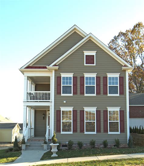 taupe colored house with metal hipp roof|taupe siding colors.